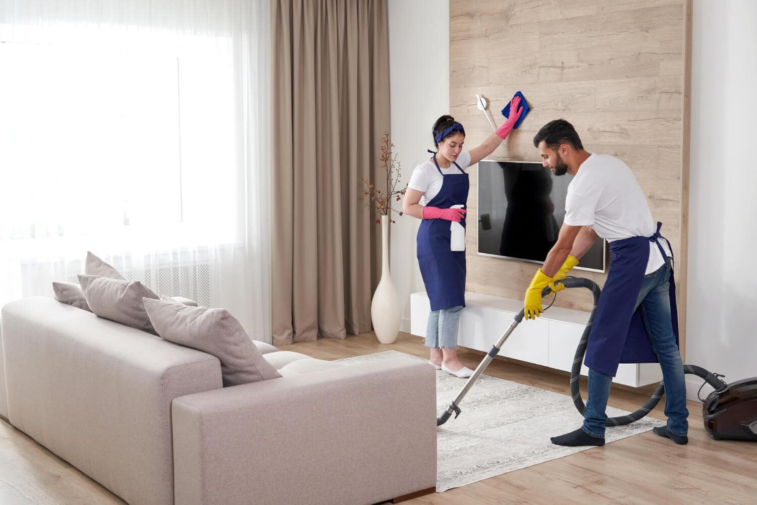 professional-cleaning-service-team-cleans-living-room-modern-apartment (1)
