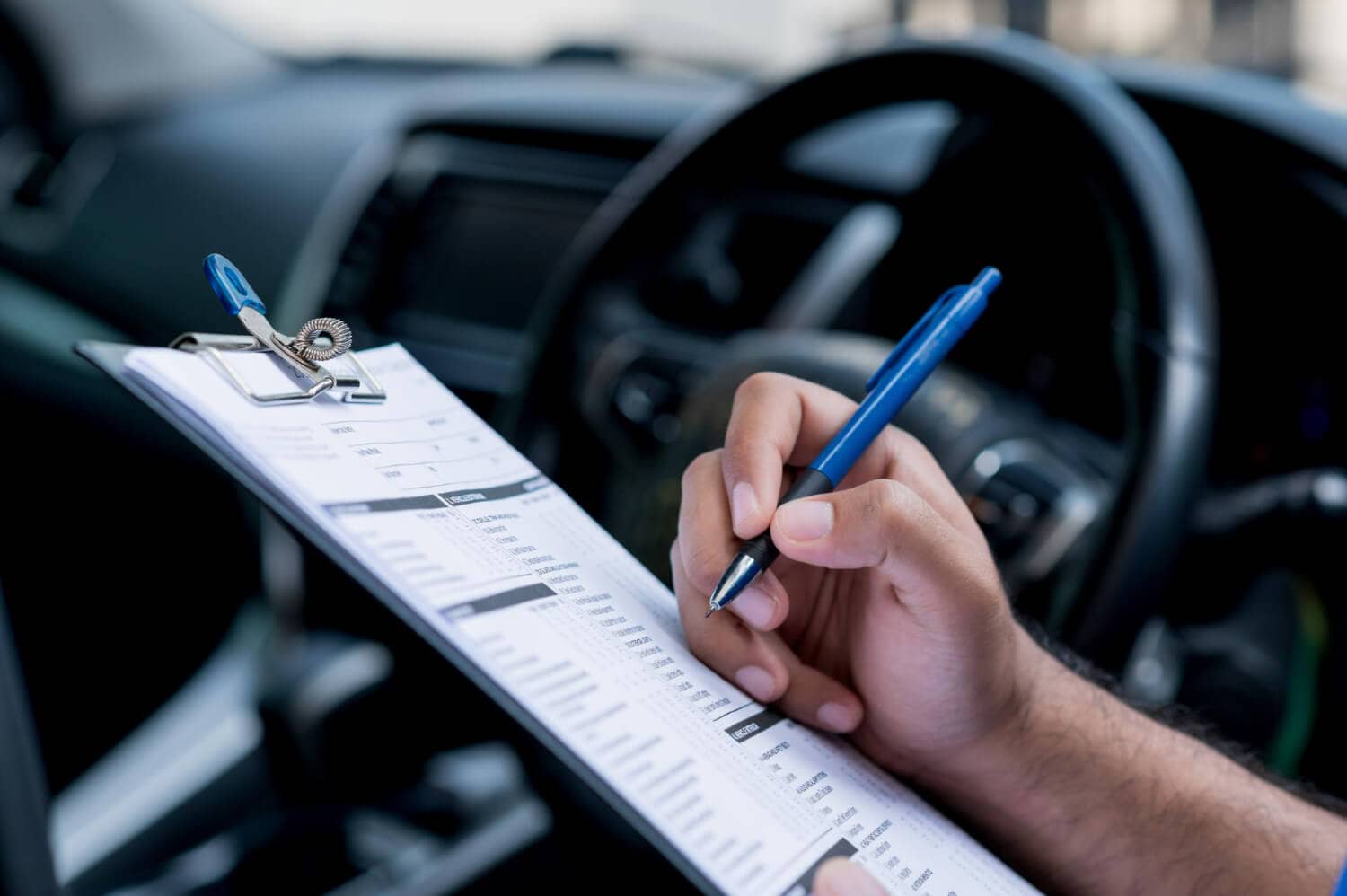 car maintenance worker is checking list car interior workshop customer 1